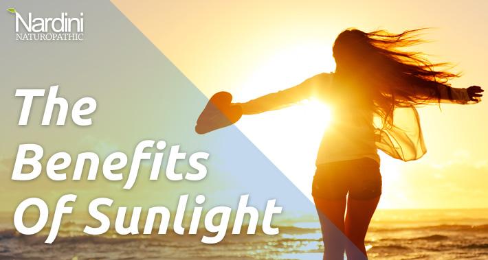 The Benefits of Sunlight | Women Spreading Her Arms on the Beach Looking at the Sun | Dr. Pat Nardini | Belleville Naturopath
